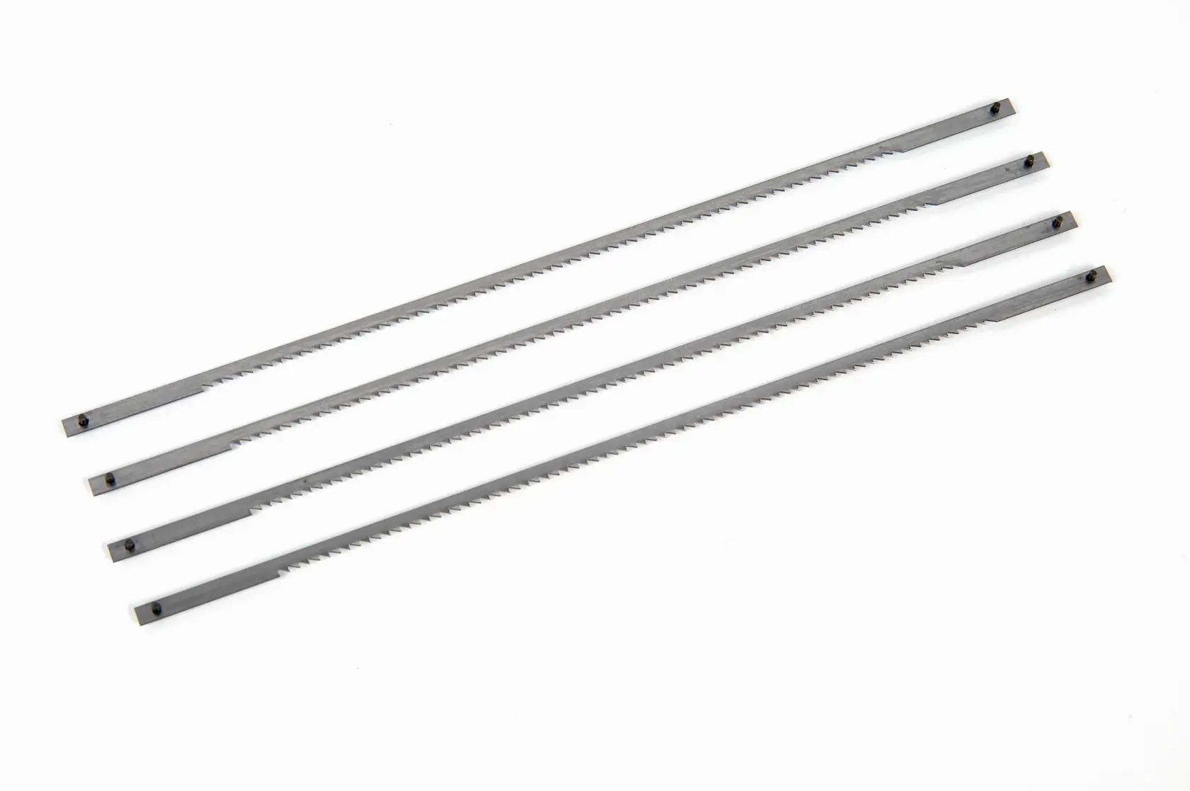STANLEY 0-15-061 set of four silver-colored coping saw blades, top view on white background.