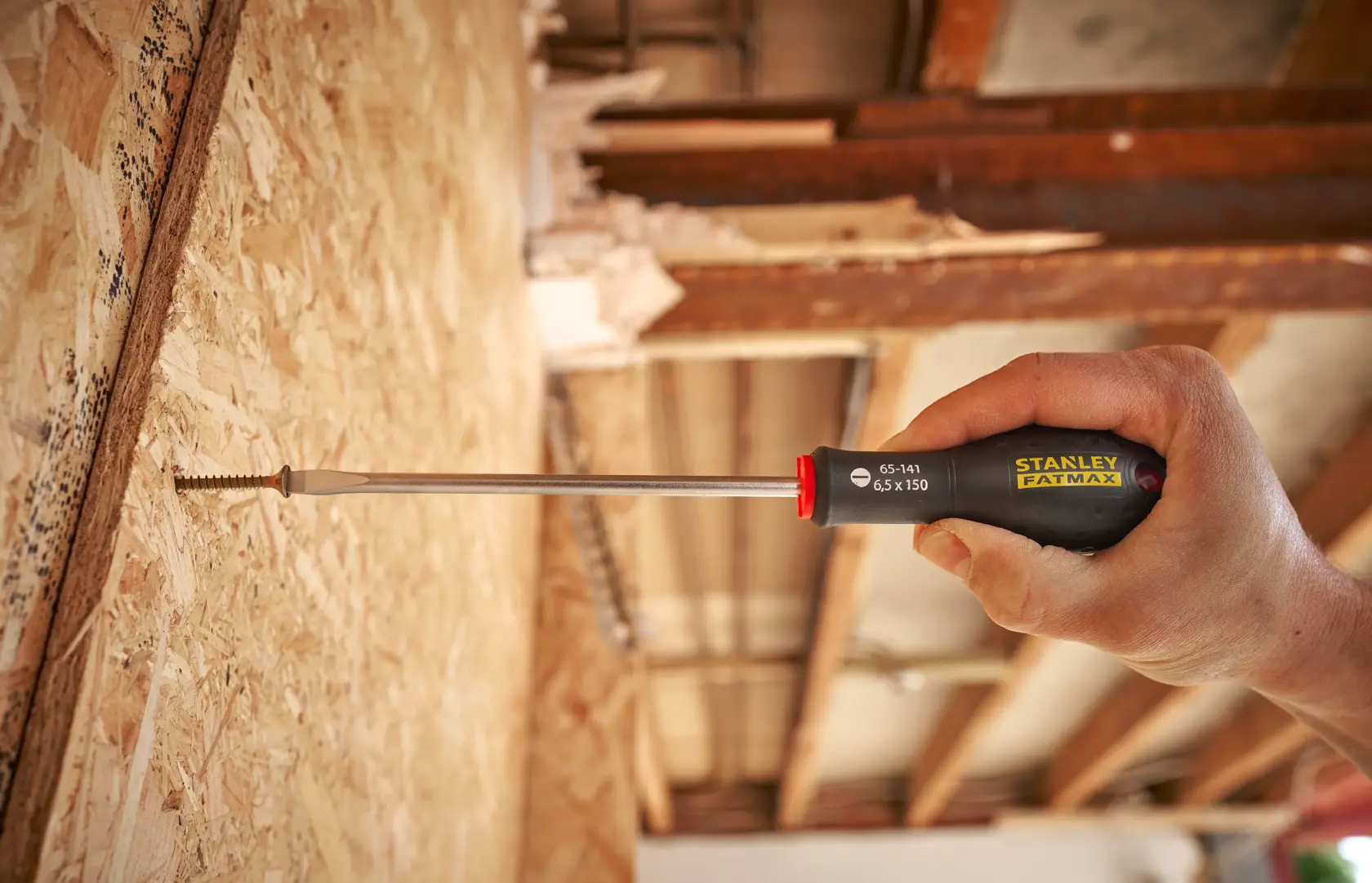 STANLEY® FATMAX® Slotted Flared 6.5 x 150mm Screwdriver Application Action Shot Hand/Person