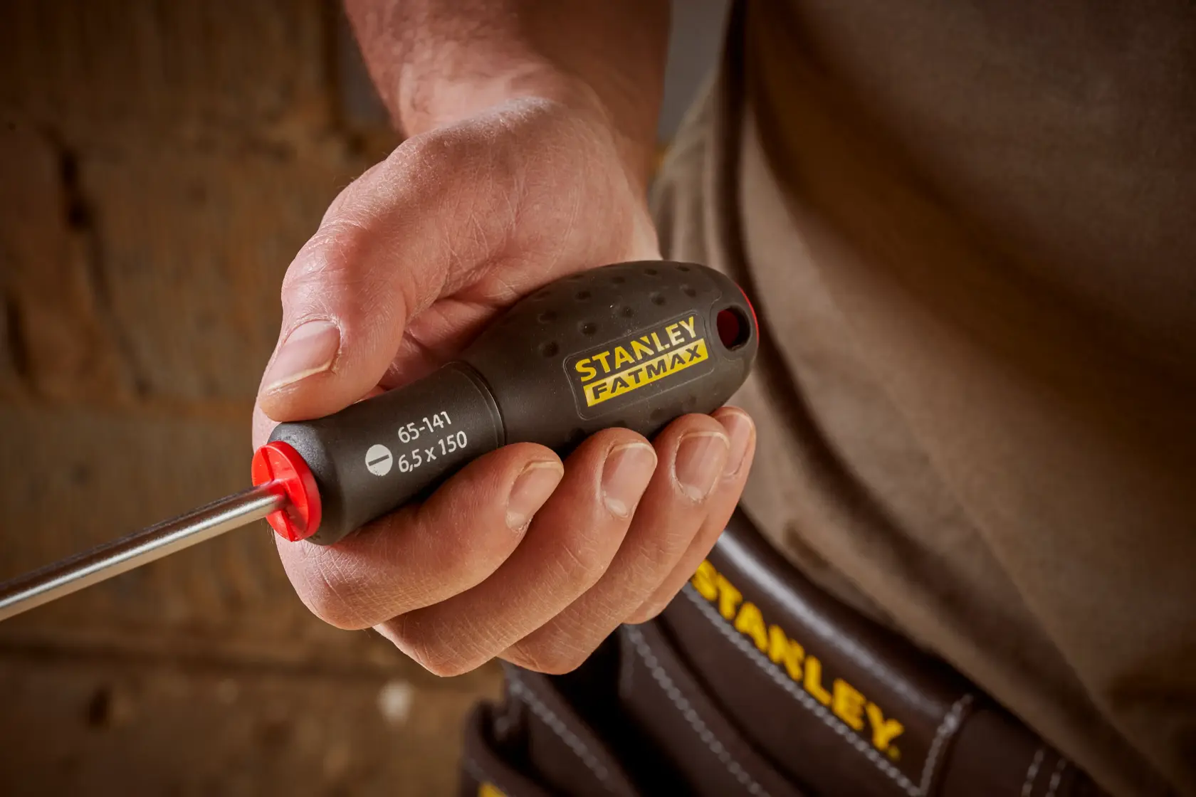 STANLEY® FATMAX® Slotted Flared 6.5 x 150mm Screwdriver Application Action Shot Hand/Person