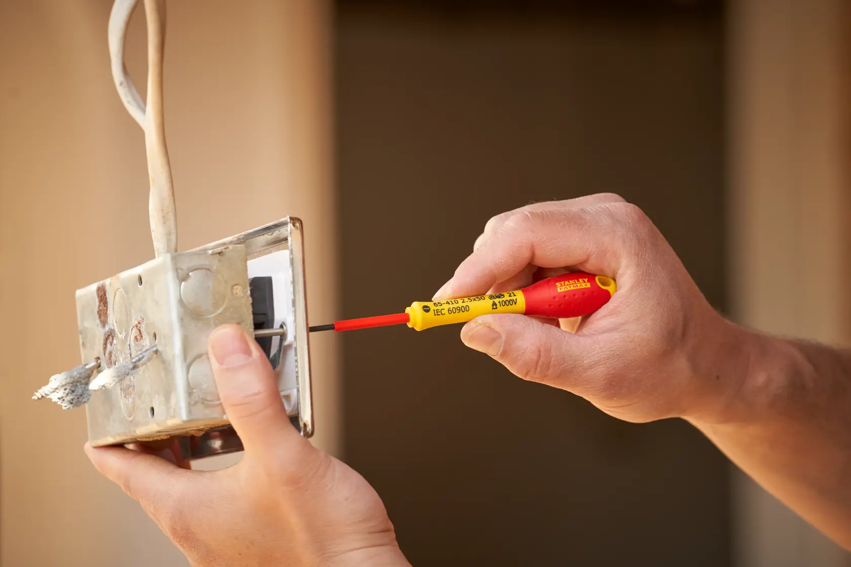 STANLEY® FATMAX® Insulated Slotted 2.5mm x 50mm Screwdriver Application Action Shot Hand/Person