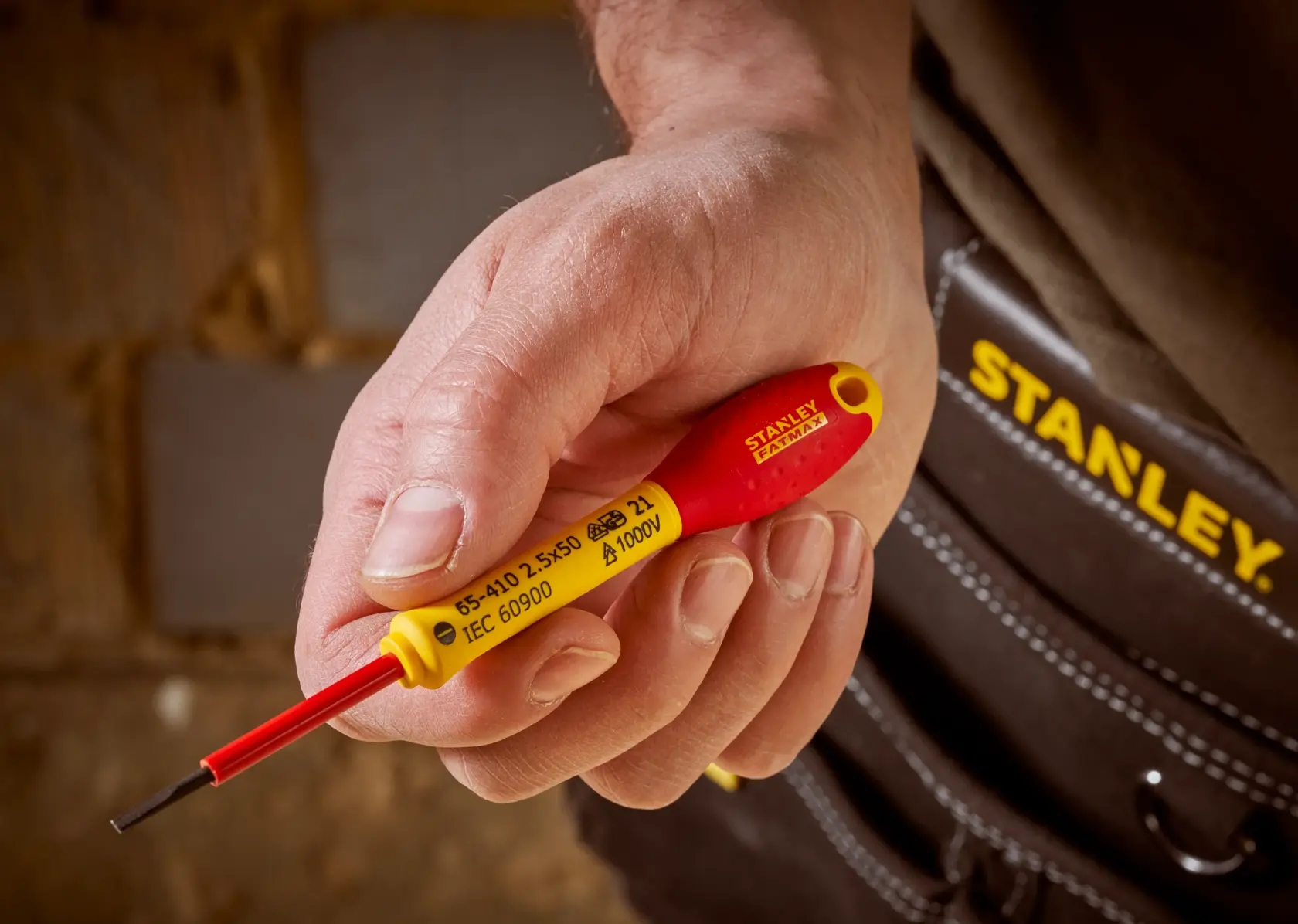 STANLEY® FATMAX® Insulated Slotted 2.5mm x 50mm Screwdriver Application Action Shot Hand/Person