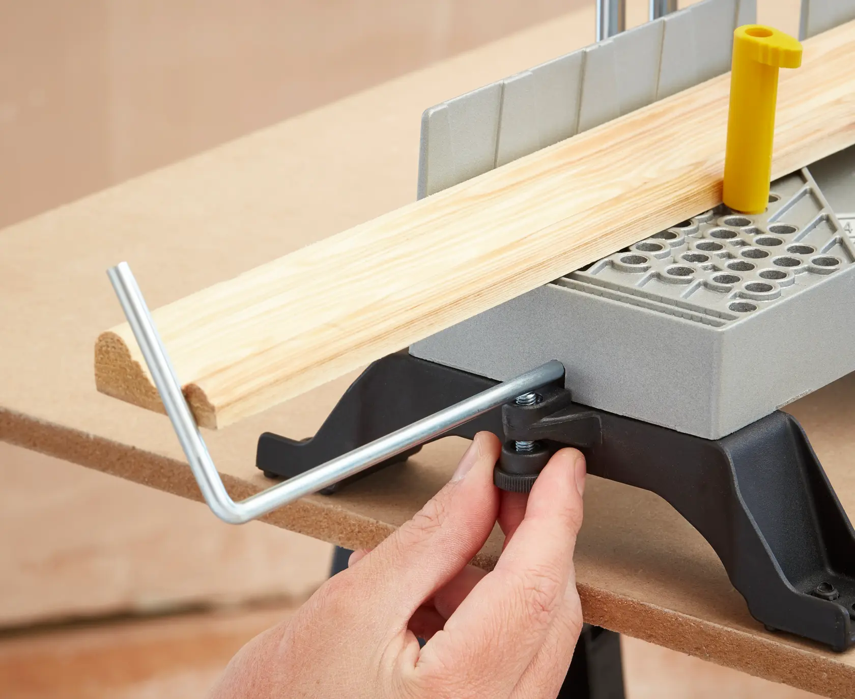 STANLEY 1-20-800 miter box with saw guide, wood piece positioned, close-up angle on white background.