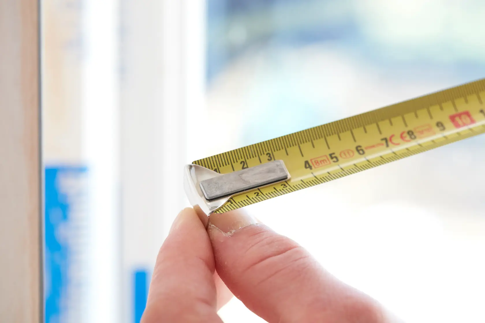 STANLEY 1-33-198 tape measure photography showing yellow blade and metal hook in close-up.