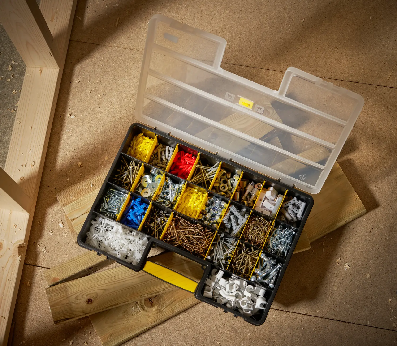 STANLEY 1-92-762 organizer box filled with assorted screws, nails, anchors, and washers, top view.