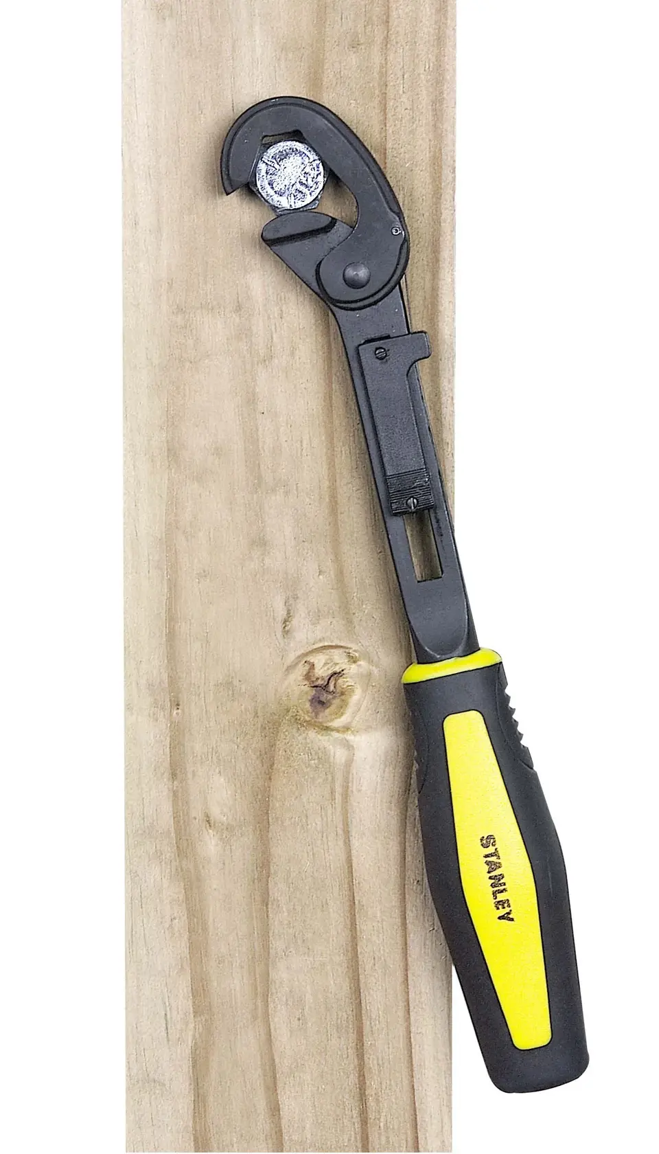 STANLEY 4-87-988 adjustable wrench with black and yellow handle gripping a bolt on wood, side view.