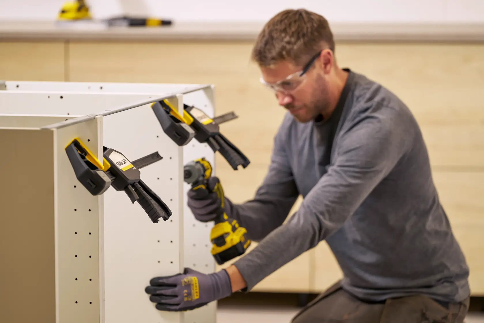 Photo of STANLEY FMHT83279-0 clamp used to secure cabinet parts during assembly, side angle view.