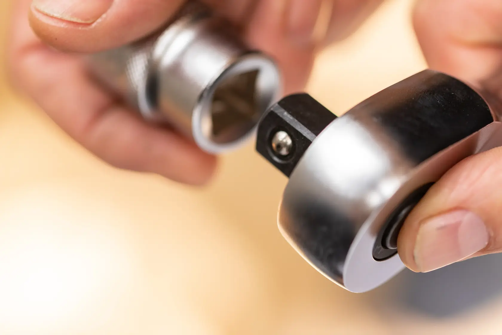 Close-up photography of STANLEY FMMT17208-0 ratchet and socket connection in hand.