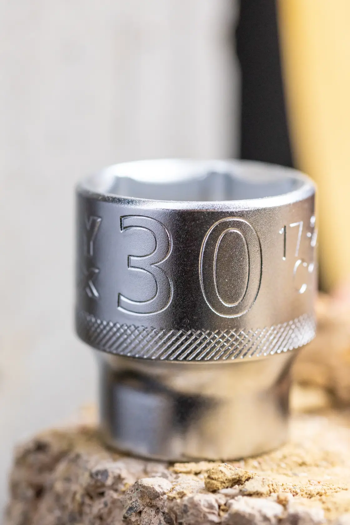 STANLEY FMMT17215-0 chrome socket 30mm, close-up showing engraved size, photographed on a stone surface.