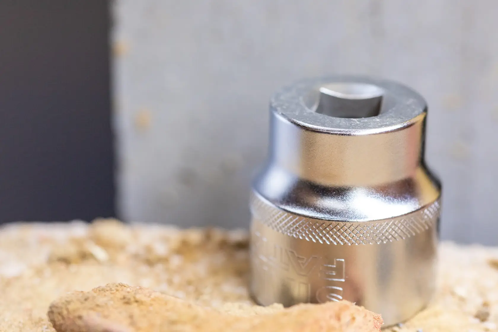 STANLEY FMMT17224-0 socket, chrome finish, photography of tool on sandy surface.