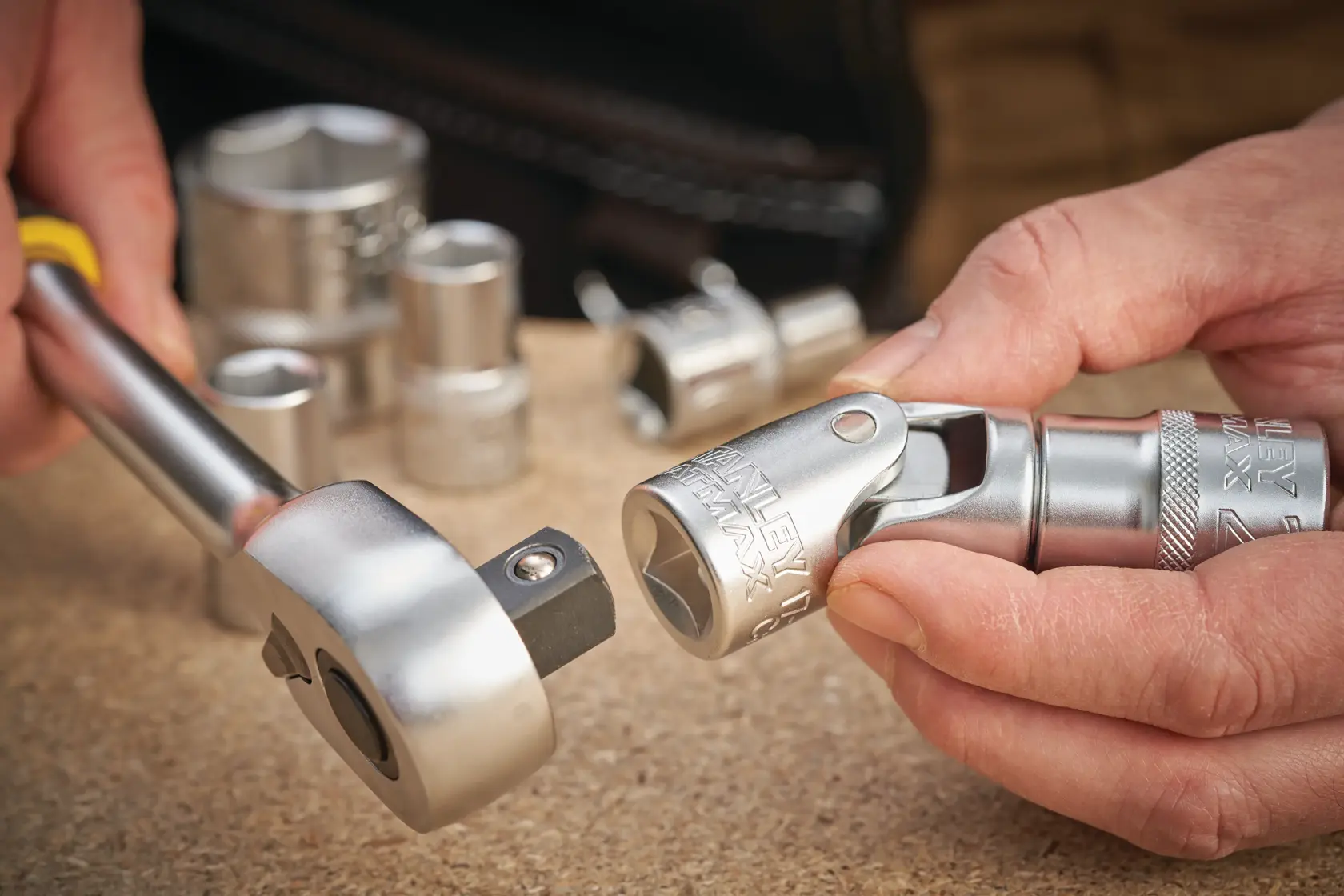 STANLEY FMMT17999-0 socket and ratchet set in use, close-up photo on work surface.