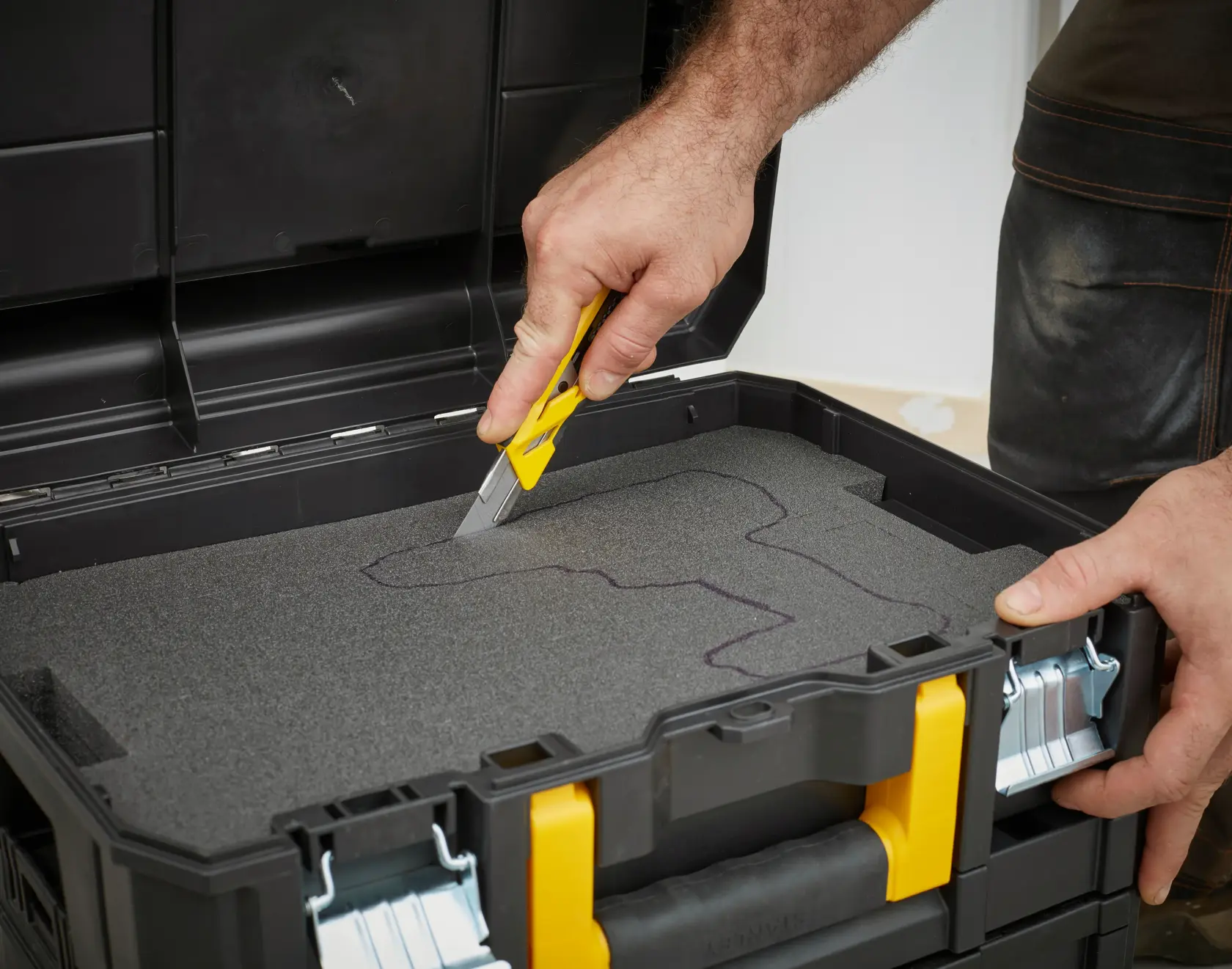STANLEY FMST1-72365 toolbox with foam insert, being cut to fit tools, front angle photo.