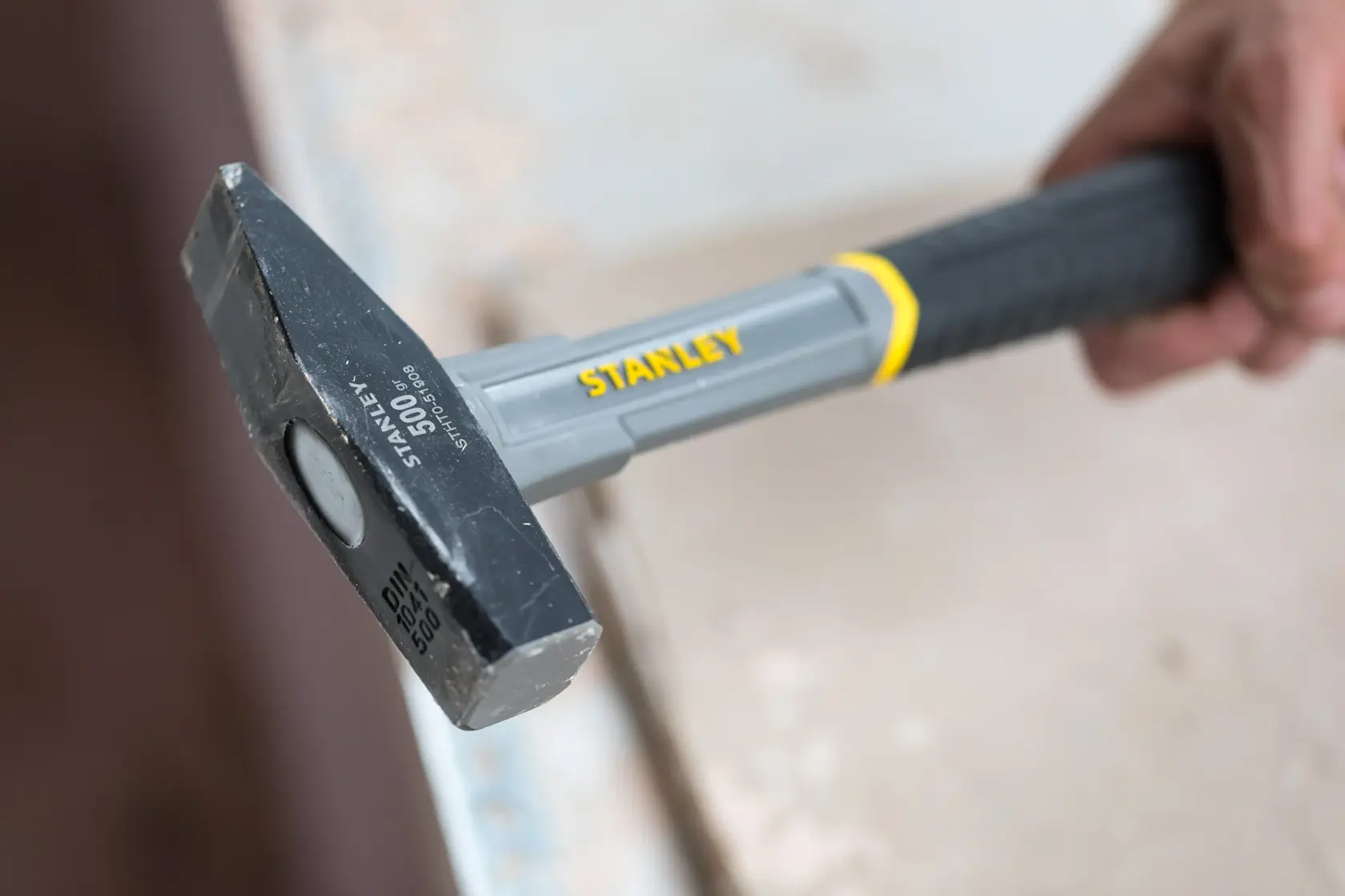 Stanley STHT0-51908 club hammer with gray and black handle in close-up photography.