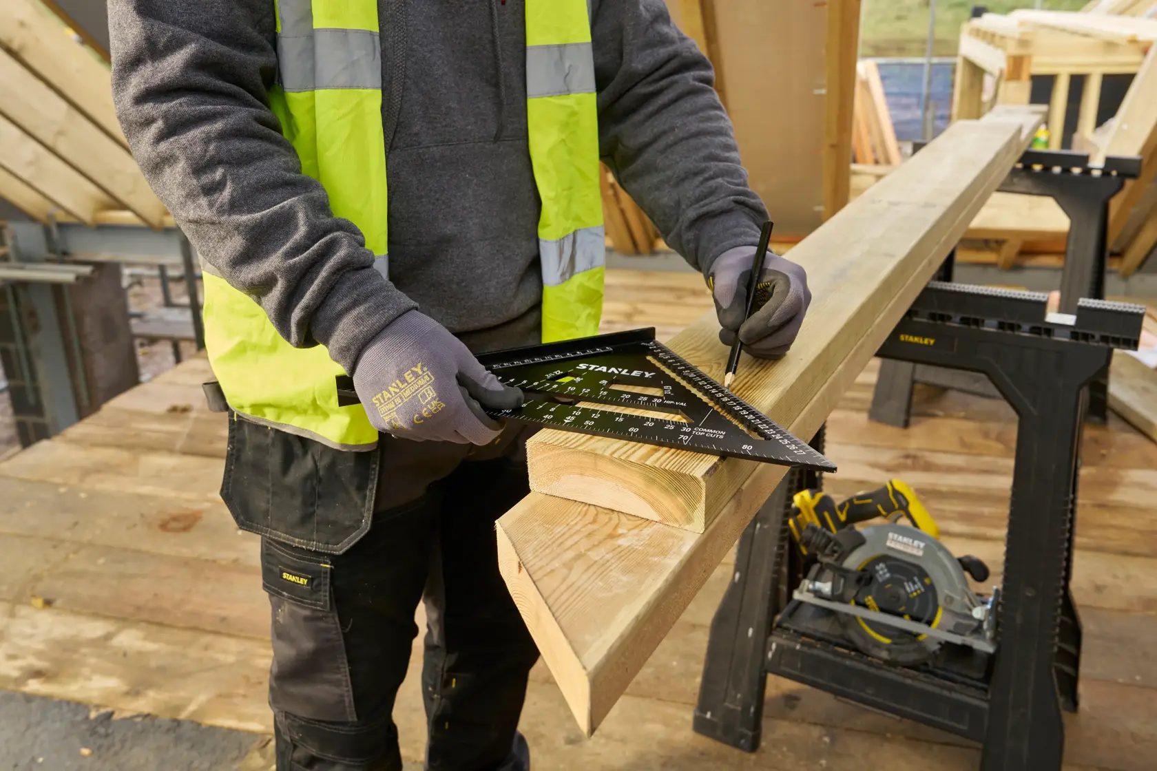STANLEY® FATMAX® QUICKSQUARE® 300MM Premium Rafter Square being used to mark a wood piece