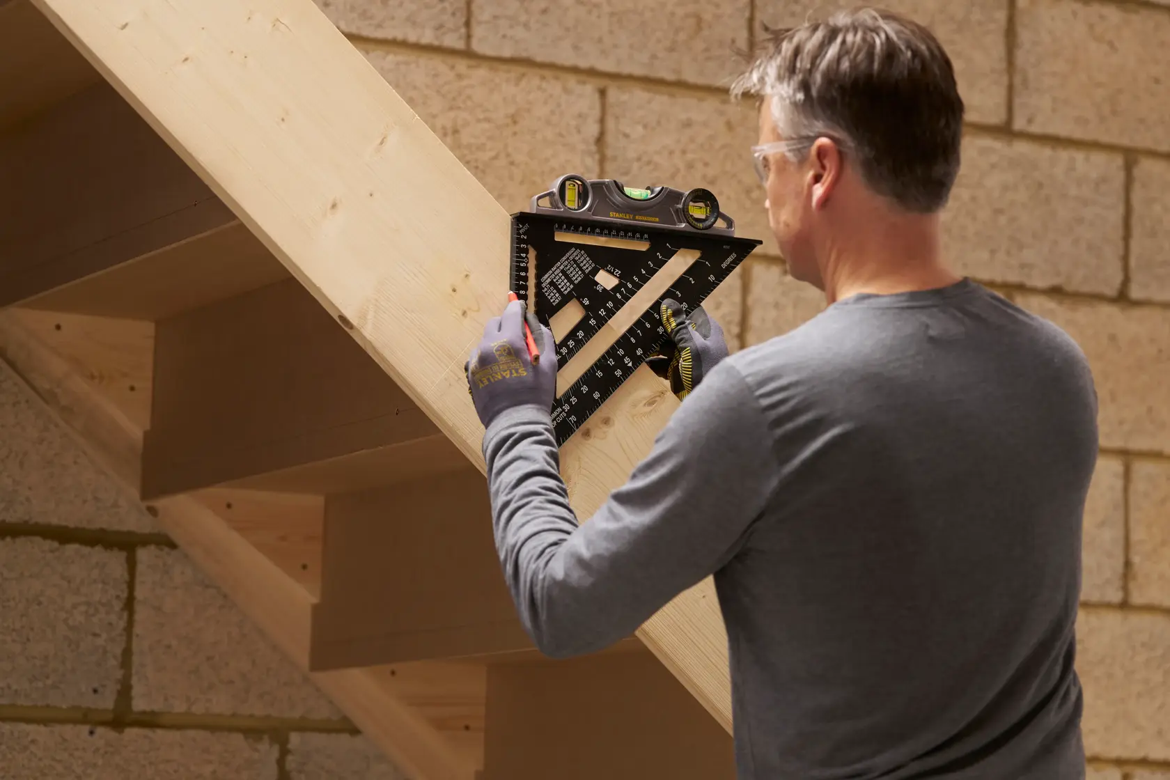 STANLEY® FATMAX® QUICKSQUARE® 300MM Premium Rafter Square being used on a staircase