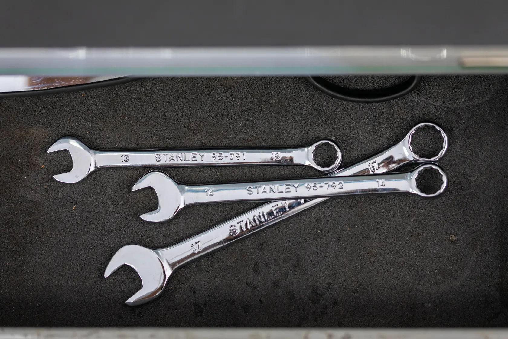 STANLEY STMT95789-0 silver combination wrenches set in drawer, top down angle, photography