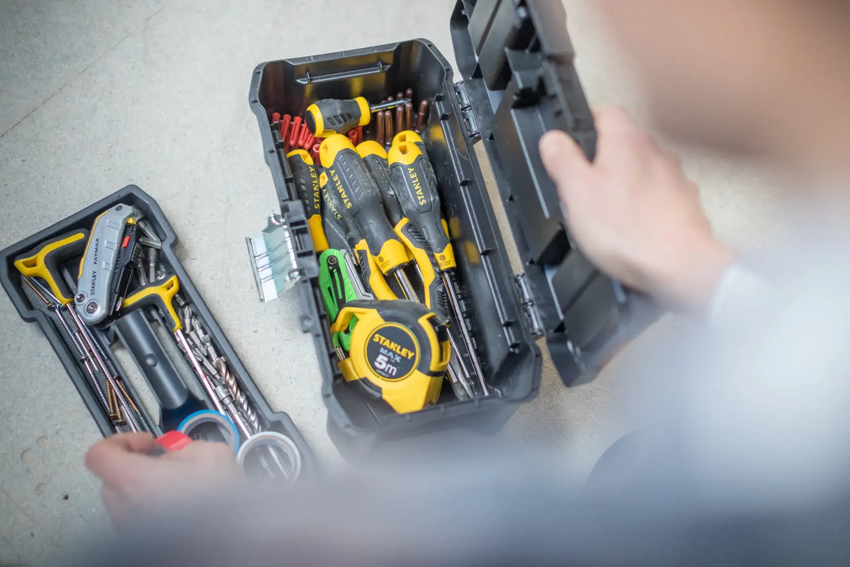 STANLEY STST1-75515 toolbox with assorted hand tools and tape measure, photography from above.