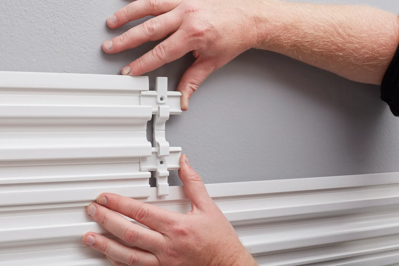 STANLEY STST82610-1 photography showing hands connecting white wall mounting rails.